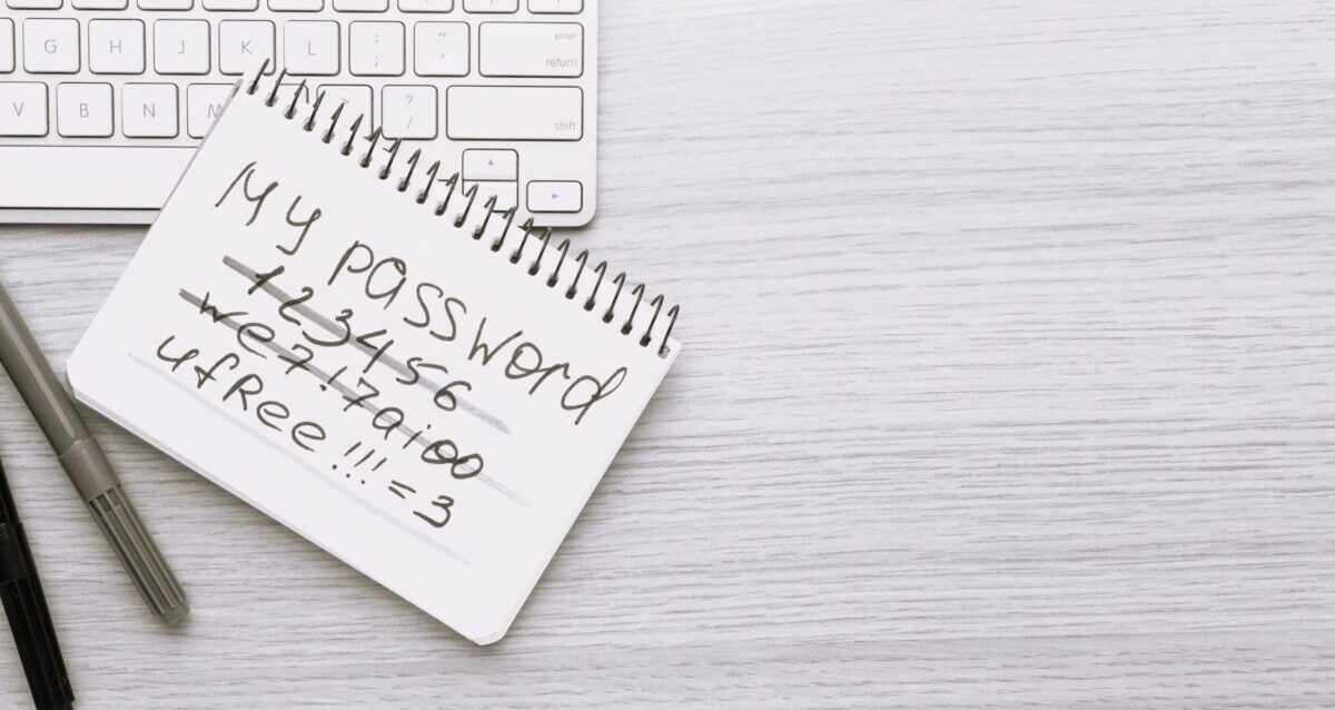 flat-lay-keyboard-with-copy-space-notebook-with-password-scaled-e1717685588580